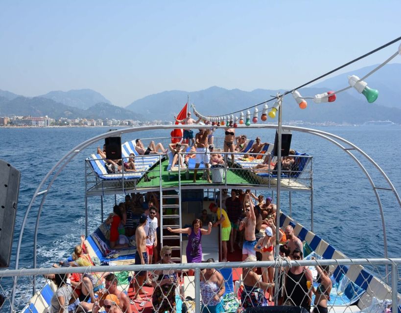 Kusadasi: Full-Day Boat Cruise w/ Lunch & Hotel Pickup - Music, crew entertainment, and the foam party